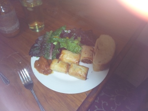 Sunday dinner - sourdough bread, Silkie and sweet potato sausage rolls, mixed greens and chutney.